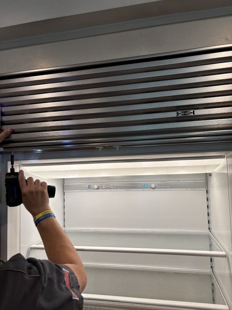 Sub-Zero refrigerator inspection in progress