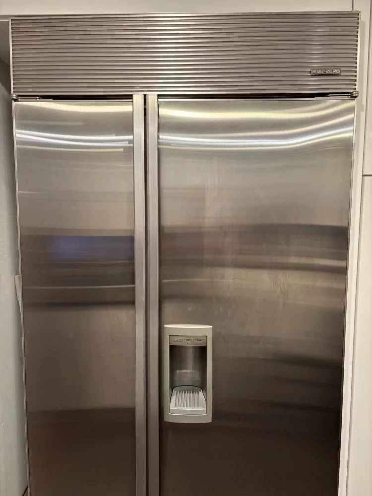 Stainless Sub-Zero refrigerator during a service visit